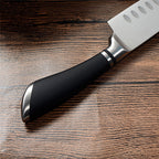 Stainless steel knife with steel ring and horseshoe handle